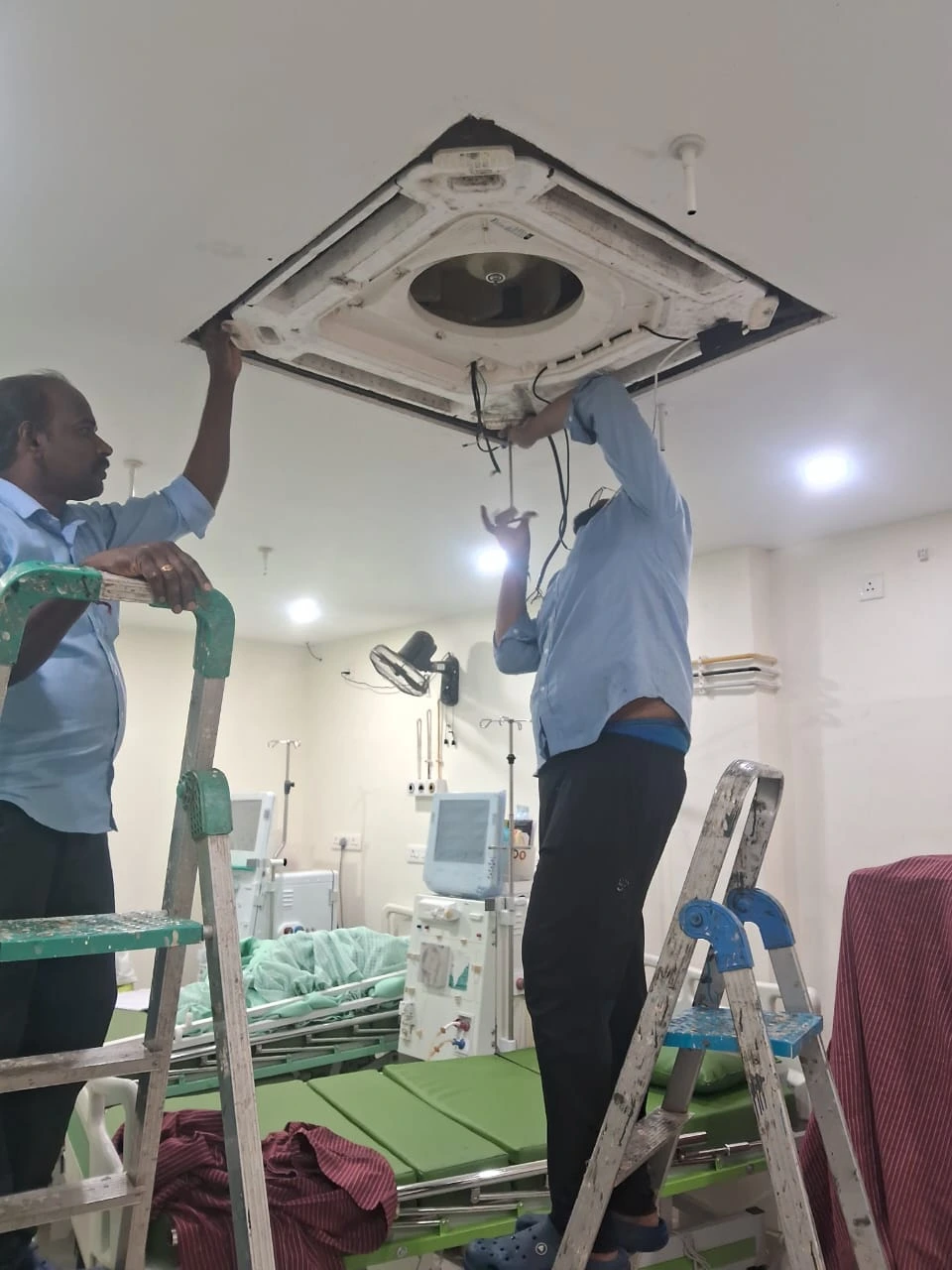 AC Repair Technician at Work